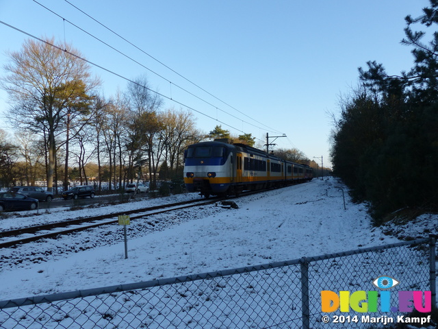 FZ011118 Train through snow covered landscape